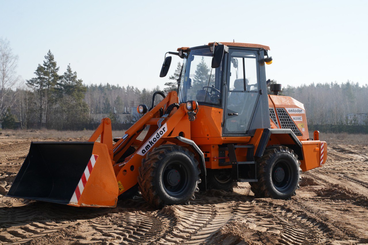 Погрузчик универсальный AMKODOR W200C - ОАО «АМКОДОР» - управляющая  компания холдинга»